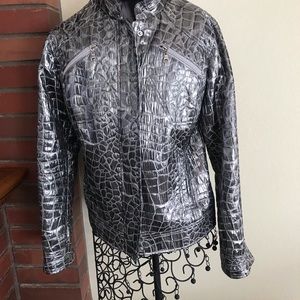 Chico silver metallic jacket. The size O.   Which is a small. Tends to run big